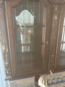 lot 2 image: Hutch base with 6 drawers, 2 cabinets  ornate gorgeous piece, top included 2 glass doors lighted from the Crown mark Inc. cherry wood- Side Note the tan color seen in photo in paper that has stuck to the item listed no damages