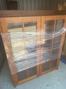 lot 38 image: Wood cabinet with glass doors, three shelves, 604816