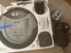 lot 165 image: IROBOT ROOMBA - with charger and plug appears new