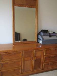 lot 21 image: 9 drawer dresser and mirror, beautiful piece of furniture, three drawers are hidden behind doors