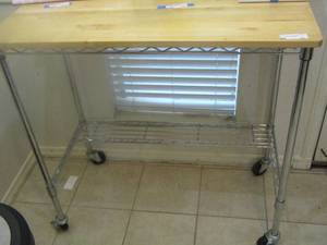 lot 12 image: Butcher block rolling kitchen island or could be used for whatever your heart desires