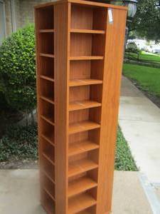 lot 7 image: Spinning movie cabinet  with lots of storage space, 4 sides