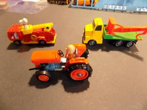 lot 208 image: AVIVA-  SNOOPY ON FIRETRUCK #C-1,  1950 CHARLIE BROWN ON TRACTOR COPR  LONE STAR IMPY ENGLAND