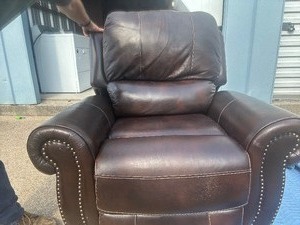 lot 51 image: Electric powered over size brown recliner, leather