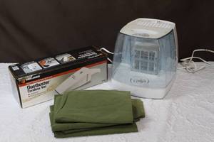 lot 30 image: Equate Invisible Cool Mist Humidifier  hand held dust buster cordless vac and some pillow cases