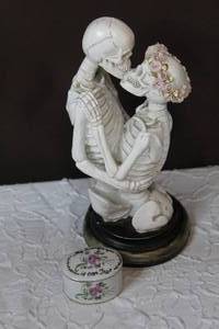 lot 37 image: ASHLAND HALLOWEEN WICKED GARDEN KISSING SKELETONS TABLETOP DECOR STATUE 10.5 and a small glass trinket box with my love for you is ever true