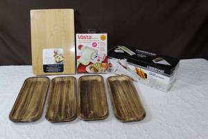 lot 57 image: Bamboo cutting board with compartment trays still wrapped in plastic Vasta sheet slicerV-Blade Mandoline slicerand 4-wood trays