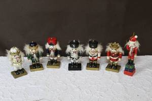 lot 61 image: Lot of miniature nutcrackers 2nt picture has a water bottle in picture so you can see size