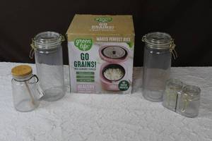 lot 81 image: Green life rice&Bean cooker looks like it was never used and glass canisters