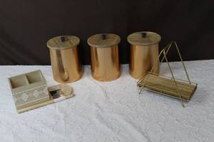 lot 82 image: 3 canisters still wrapped in plastic paper towel and silverware holder and napkin holder