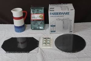 lot 85 image: Farberware cordless hand mixer looks like it was never used all looks to be in the box as well and 2 slate serving trays and more see pictures