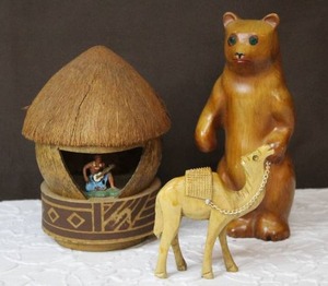 lot 111 image: vintage Hawaiian Coconut Tiki Hut, and hand-carved camel figurine,and bear figurine