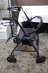 lot 132 image: Walker with seat and brakes and small storage compartment under seat