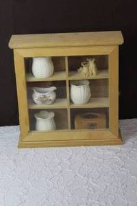 lot 150 image: Hanging glass shelf with opening door all figures included