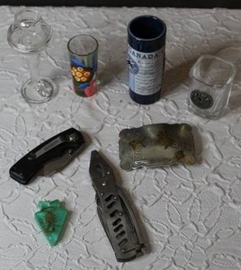 lot 158 image: Scorpion charm belt buckleshoot glasses and a few tools