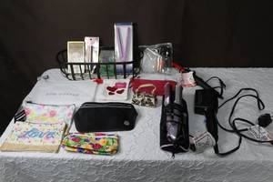 lot 195 image: Mixed lot makeup bags with tags coin purse with butterflys Carl and iron and so much more see pictures