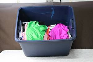 lot 198 image: Tote full of teen tops and a few bottoms ranging in sizes