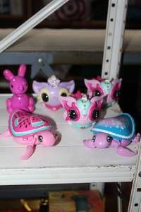 lot 242 image: WowWee Pixie Belles interactive electronic pets turtle figureSqueakee Minis Poppy the Bunny interactive balloon toy.