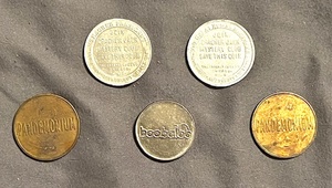 lot 46 image: Two (2) Vintage Cracker Jack Mystery Club Presidents Coins, Two (2) Pandemonium Austin, Texas Tokens, &amp One (1) Boobaloo Shopping CartStroller Arcade Trade Token.&nbsp