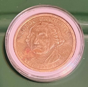 lot 61 image: 2007 George Washington Dollar Coin W Rim Break Cud Causing Lady Libertys Hand to Look Like it is in a Cast