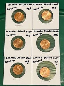 lot 91 image: Six (6) UncirculatedMint Shape Lincoln Shield Cents - 2010-D, (3x) 2017-D, 2018-D, &amp 2021-D