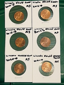 lot 93 image: Six (6) UncirculatedMint Shape Lincoln Shield Cents - 2010-D, 2012-D, 2013-D, 2019-D, 2020-D, &amp 2021-D