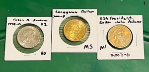 lot 96 image: 2000-P UncirculatedMint Shape Sacagwea Dollar W Almost Uncirculated 1979 Susan B. Anthony Dollar &amp 2007-D John Adams Dollar