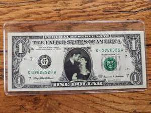 lot 53 image: Collectible Rhett & Scarlett $1 bill
