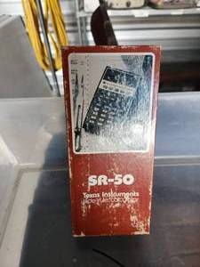 lot 37 image: Vintage SR-50 Texas Instruments slide rule calculator in box