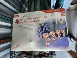 lot 121 image: 2 boxes of 4 halographic candy cane pathway markers