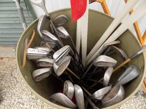 lot 398 image: GOLF CLUBS  WOODS  - PIN SEEKER,  IRONS  20 PLUS  & 4 FLAGS  IN A BARREL
