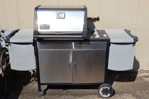 lot 4 image: Outdoor Grill by Weber Genesis Gold. Currently attached to home gas line, bring tools to remove.