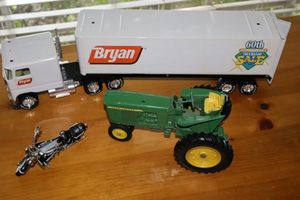 lot 14 image: Model toys Bryan truck, John Deere tractor and Police motorcycle