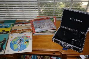 lot 41 image: Modern Victrola record player with vintage record albums (last picture is empty sleeves)