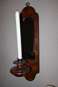 lot 18 image: Pair of wooden wall sconces with mirror. Features metal candle holder with wax drip catcher