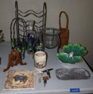 lot 19 image: Home dcor vintage  hand painted double leaf serving dish, wine stoppers, painted decanter and carafe, wine rack, wine bottle baskets and more