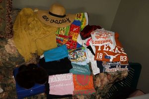 lot 26 image: Womens clothes and Welve furry slippers, includes Texas Longhorns T-shirts, on vacay sun hat and more