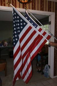 lot 54 image: Two American flags with poles made in USA