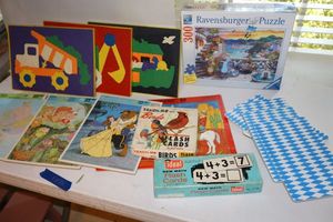 lot 72 image: Puzzles and flash cards. Ravensburger puzzle is unopened.