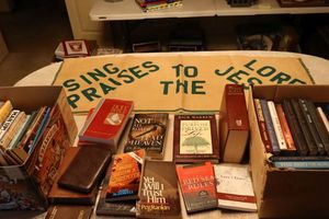 lot 64 image: Adult Christian books and Bibles with banner