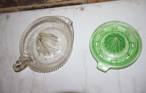 lot 166 image: Uranium glass hand juicer (for display only recommended) and Vintage clear glass juicer