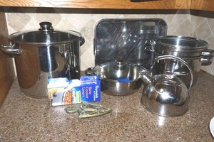 lot 172 image: Stainless cooking pans stock pots and tea kettle with trivet