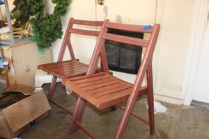 lot 282 image: Pair of wooden folding chairs by Apple furniture