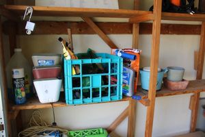 lot 297 image: Garden bug killers, faucet covers, Flex Seal, yard tools