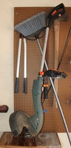 lot 314 image: Black & Decker trimmerEdger, axe, broom, and branch trimmer