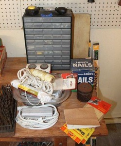 lot 323 image: Hardware storage organizer, sandpaper, PVC pipe sealer, see photos