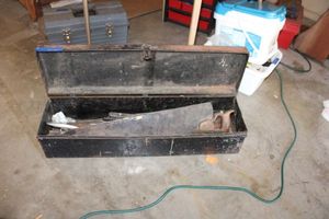 lot 330 image: Vintage black metal toolbox with hand saws and more