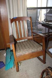 lot 111 image: Vintage oak rocking chair, upholstered seat has springs