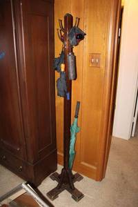 lot 90 image: Wood coat stand with umbrellas