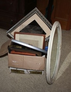 lot 91 image: Oval wall mirror and vintage photo frames